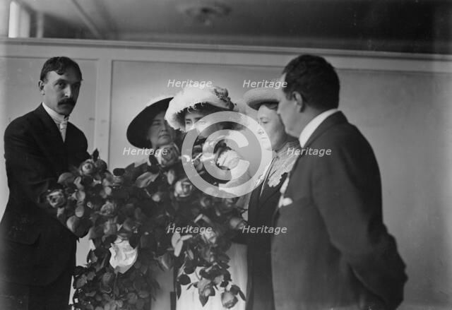 Irving Bertman presents flowers to Helen Keller, Flower Show, 1913. Creator: Bain News Service.
