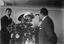 Irving Bertman presents flowers to Helen Keller, Flower Show, 1913. Creator: Bain News Service