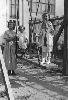 Irina, Yuliy and Vera Briner with nanny Katya in the courtyard of a house on Svetlanskaya St, 1923. Creator: Unknown