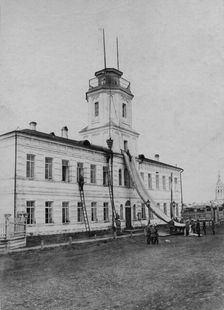 Irkutsk police fire brigade. Exercise with a rescue sheet and a rescue basket, 1894. Creator: R Prorokov