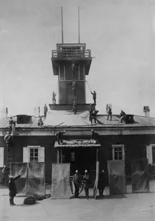 Irkutsk police fire brigade. Exercise with tarpaulins, shields, crowbar and hooks, 1894. Creator: R Prorokov