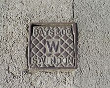 Iron water stop tap cover plate made by Bays and Company, Swindon, Wiltshire, 2006. Artist: Peter Williams