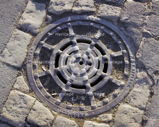 Iron drain cover made by Affleck, Prospect Works, Swindon, Wiltshire, 2006. Artist: Peter Williams.