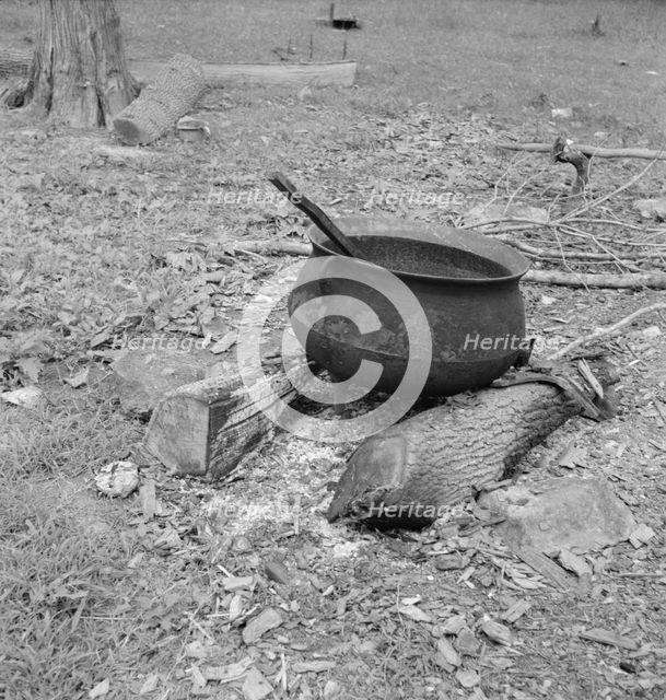 Iron pot for heating...in the yard of Negro tobacco farmer, Person County, North Carolina, 1939. Creator: Dorothea Lange.