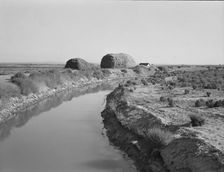 Irrigation canal and the preacher's farm, Dead Ox Flat, Malheur County, Oregon, 1939. Creator: Dorothea Lange
