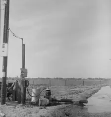 Irrigation pump on edge of field, San Joaquin Valley, California, 1938. Creator: Dorothea Lange