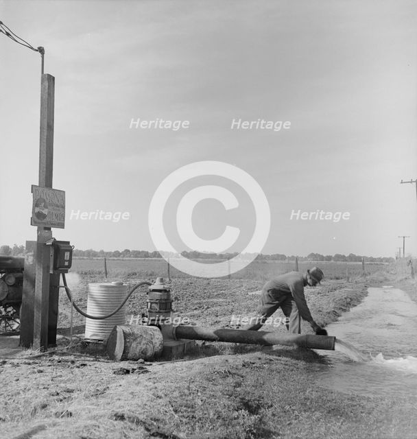 Irrigation pump on edge of field, San Joaquin Valley, California, 1938. Creator: Dorothea Lange.