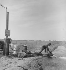 Irrigation pump on edge of field, San Joaquin Valley, California, 1938. Creator: Dorothea Lange