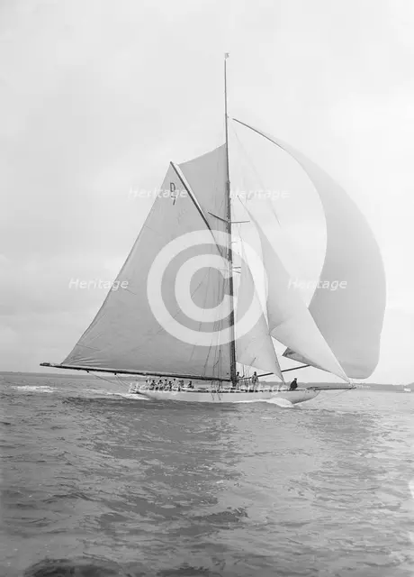 'Istria' sailing downwind under spinnaker, 1912.  Creator: Kirk & Sons of Cowes.