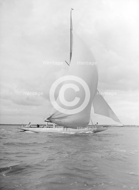 'Istria' sailing downwind under spinnaker, 1912.  Creator: Kirk & Sons of Cowes.