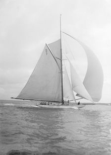 Istria sailing downwind under spinnaker, 1912. Creator: Kirk & Sons of Cowes