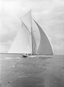 Istria sailing downwind under spinnaker, viewed from stern, 1912. Creator: Kirk & Sons of Cowes