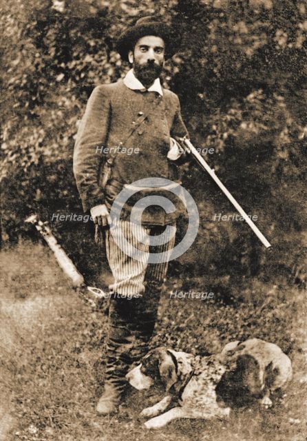 Isaac Ilyich Levitan (1860-1900) with his dog Vesta, before 1893. Creator: Anonymous.