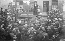 Isabel Seymour addressing a crowd of men and boys from a tradesman's cart, 1908. Creator: Unknown