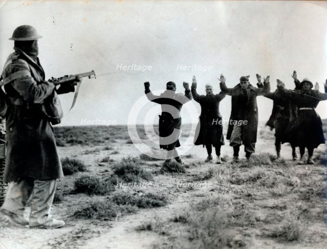 Italian troops surrender to an Australian soldier, Bardia, Libya, World War II, 1941.  Creator: Unknown.