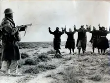 Italian troops surrender to an Australian soldier, Bardia, Libya, World War II, 1941. Creator: Unknown