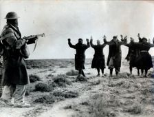 Italian troops surrender to an Australian soldier, Bardia, Libya, World War II, 1941. Creator: Unknown