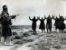 Italian troops surrender to an Australian soldier, Bardia, Libya, World War II, 1941