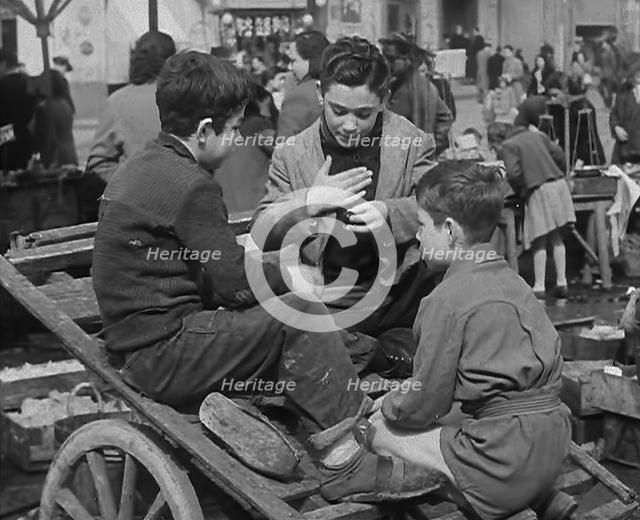 Italian Boys Talking With Other Civilians in the Background, 1944. Creator: British Pathe Ltd.