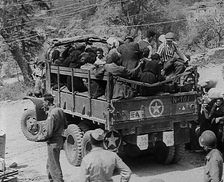 Italian Civilians Being Driven off in a US Army Truck, 1943-1944. Creator: British Pathe Ltd