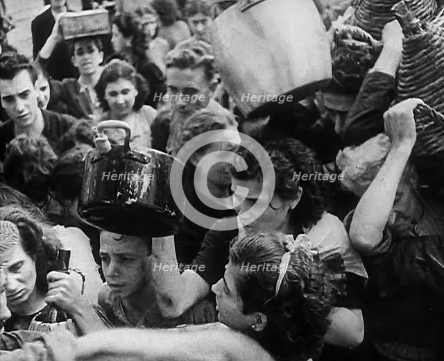 Italian Civilians Gathering Water in Naples, 1943-1944. Creator: British Pathe Ltd.
