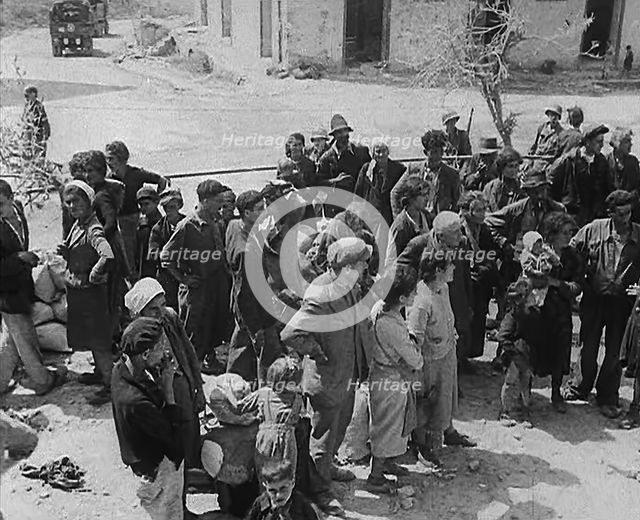 Italian Civilians in a Bomb-Damaged Italian Town, 1943-1944. Creator: British Pathe Ltd.