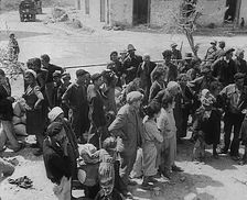 Italian Civilians in a Bomb-Damaged Italian Town, 1943-1944. Creator: British Pathe Ltd