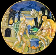 Italian earthenware plate showing Vulcan forging arrows for Cupid, c.16th century