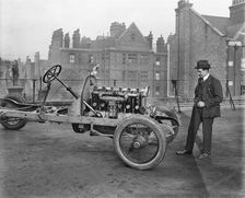 Italian racing driver Giulio Foresti with the chassis of a car, London, 1918-1919. Artist: Bedford Lemere and Company