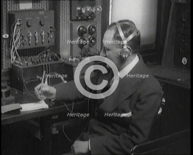 Italian Senator Guglielmo Marconi Using Radio Apparatus While Taking Notes, 1920. Creator: British Pathe Ltd.