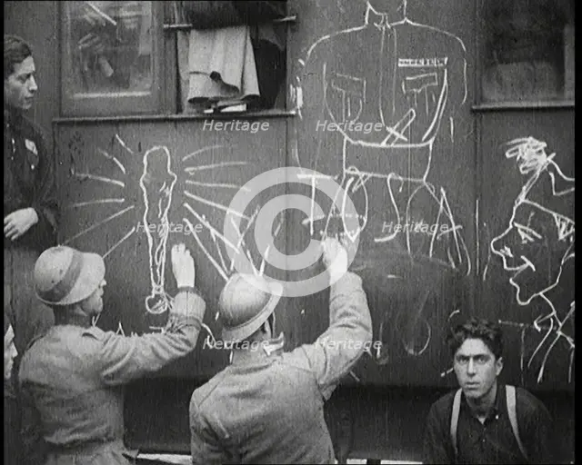 Italian Soldiers Using Chalk to Graffiti a Train, 1922. Creator: British Pathe Ltd.