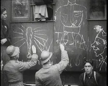 Italian Soldiers Using Chalk to Graffiti a Train, 1922. Creator: British Pathe Ltd