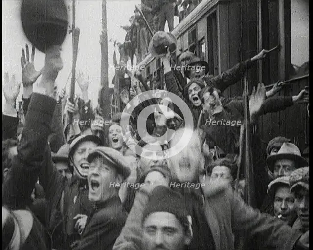 Italian Soldiers Standing on or Near a Train, Waving and Cheering, 1922. Creator: British Pathe Ltd.