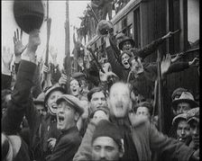 Italian Soldiers Standing on or Near a Train, Waving and Cheering, 1922. Creator: British Pathe Ltd