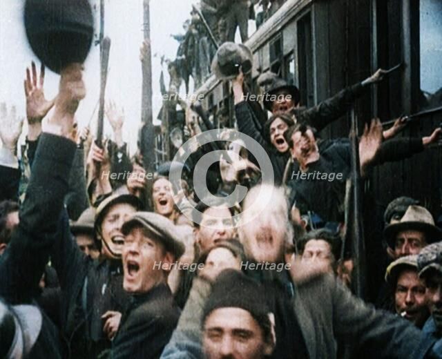 Italian Soldiers Standing on or Near a Train, Waving and Cheering, 1922. Creator: British Pathe Ltd.