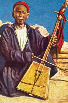 Itinerant musician, Mongolia, c1928. Creator: Unknown