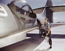 It's an intricate operation - installing a 30-calibre machine gun...Corpus Christi, Texas, 1942. Creator: Howard Hollem