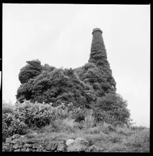 Ivy covered mine engine house and chimney, Cornwall, 1967. Creator: Eileen Deste
