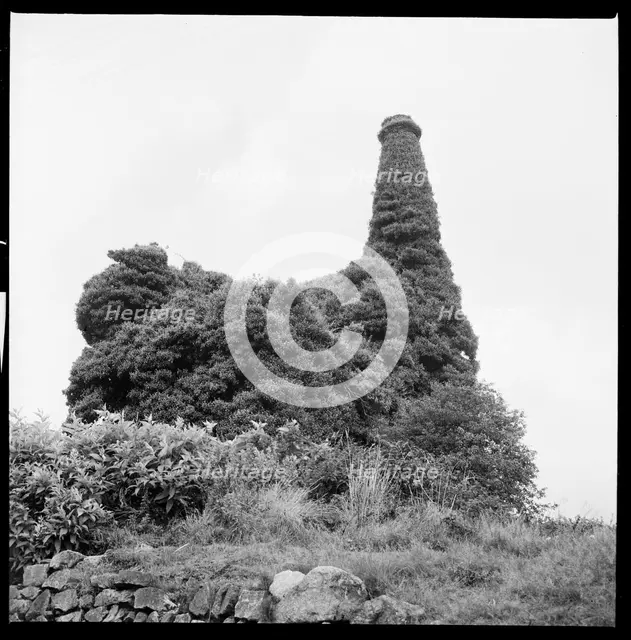 Ivy covered mine engine house and chimney, Cornwall, 1967. Creator: Eileen Deste.