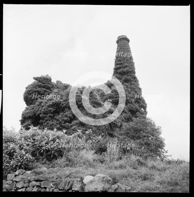 Ivy covered mine engine house and chimney, Cornwall, 1967. Creator: Eileen Deste.