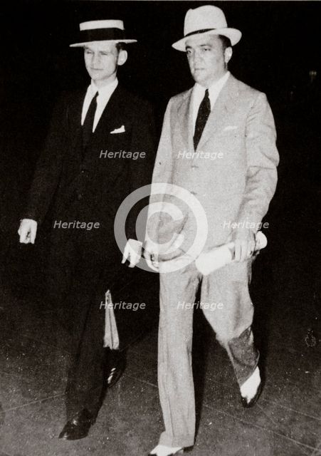 J Edgar Hoover, chief of the FBI, with head of the Chicago office Melvin Purvis, USA, mid 1930s. Artist: Unknown