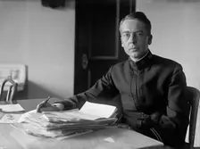 J.P. Auld, U.S.N. at Desk, 1917. Creator: Harris & Ewing