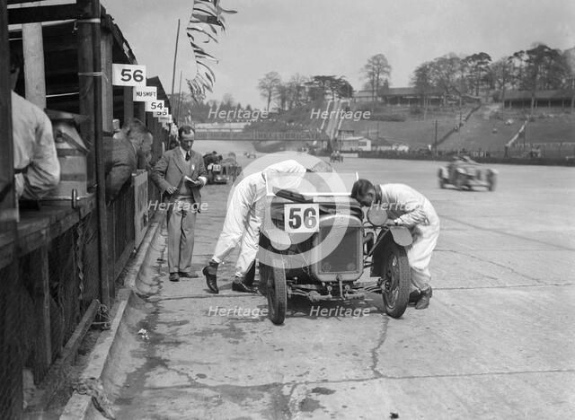 J Reeves and HHB Beacon's Austin Ulster at the JCC Double Twelve race, Brooklands, 8/9 May 1931. Artist: Bill Brunell.