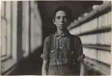 Jo Bodeon, a \back-roper\ in mule room. Chase Cotton Mill, Burlington, Vermont, 1909. Creator: Lewis Wickes Hine