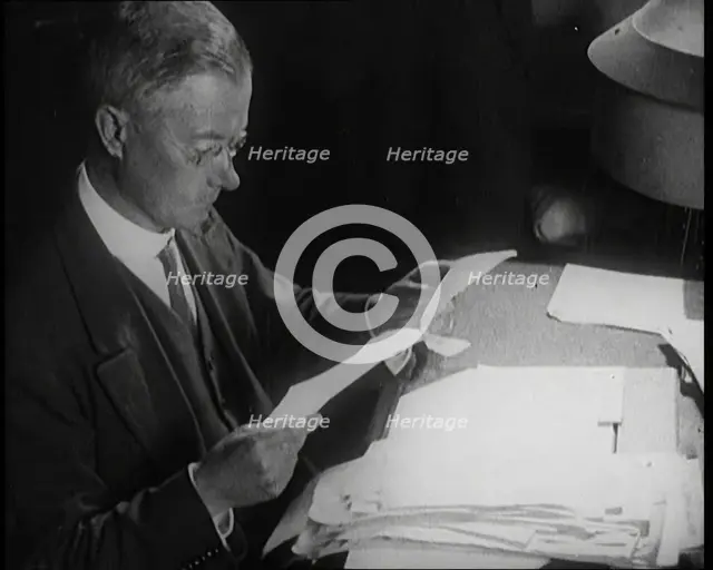 Journalist at Work Reading Notes, 1921. Creator: British Pathe Ltd.