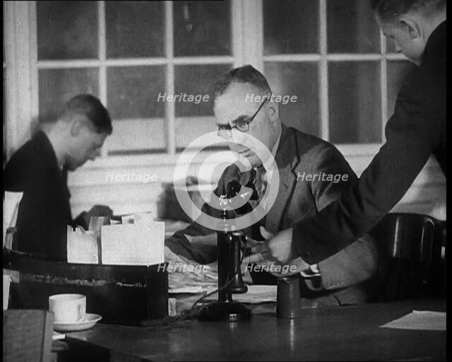 Journalist Being Handed Papers, 1933. Creator: British Pathe Ltd.