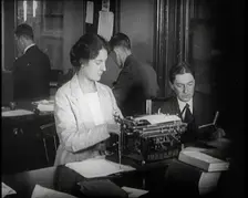 Journalists at Work Typing, Reading, and Making Notes. a Woman Is Typing What Is Being..., 1921. Creator: British Pathe Ltd