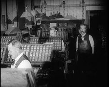 Journalists Working in the Compositing Room of a Newspaper Office, 1921. Creator: British Pathe Ltd