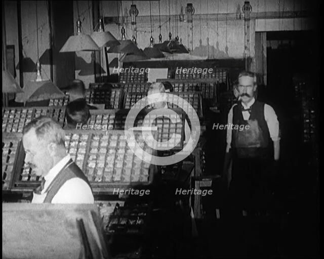Journalists Working in the Compositing Room of a Newspaper Office, 1921. Creator: British Pathe Ltd.