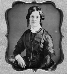 Joannette Clark Benjamin, three-quarter length portrait of a woman, facing front, seated, c1840-1860 Creator: Unknown